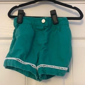 Green shorts with button and crochet detail